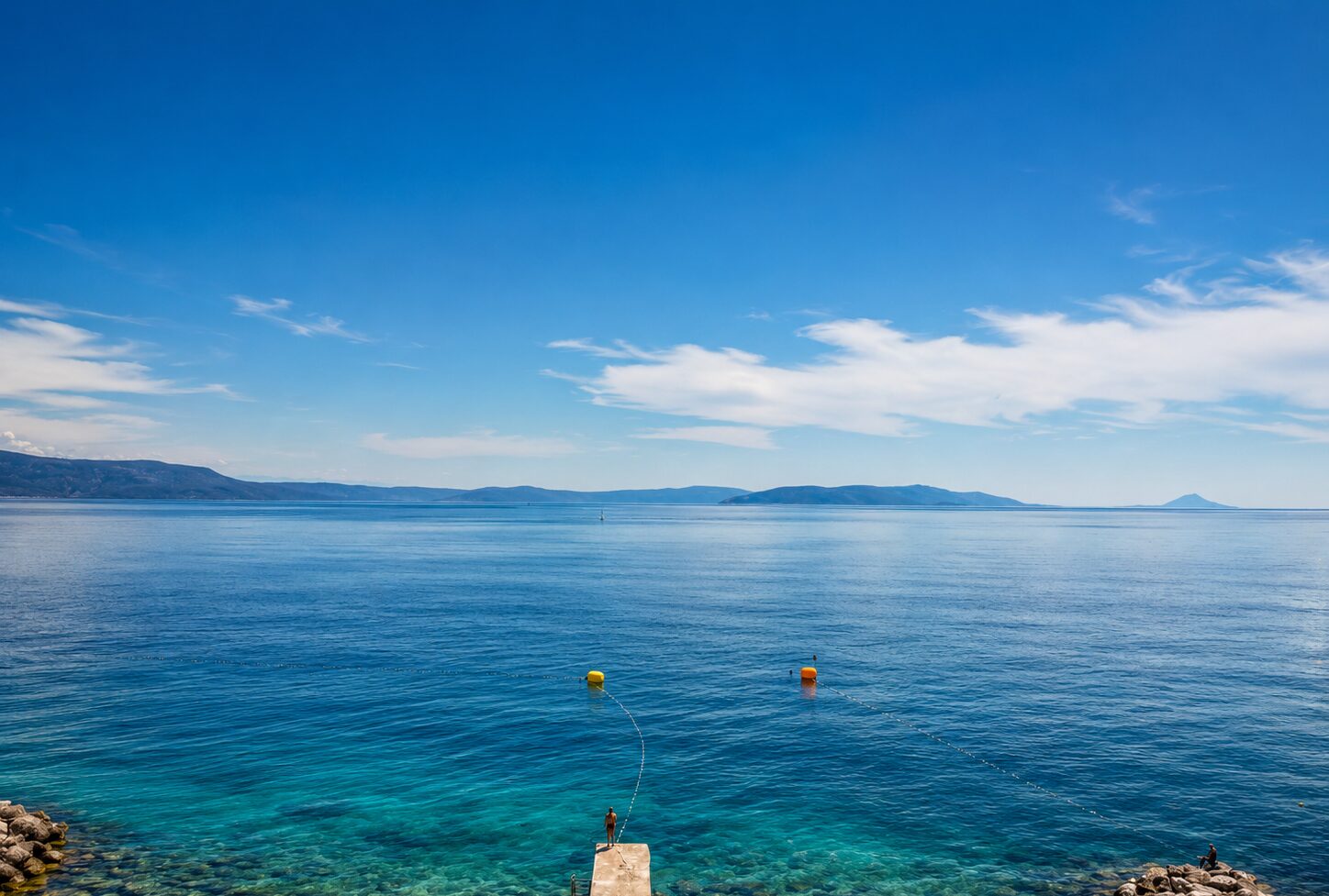 A quiet morning by the sea near Rabac Clear blue-green Kvarner water beside the coast near Rabac