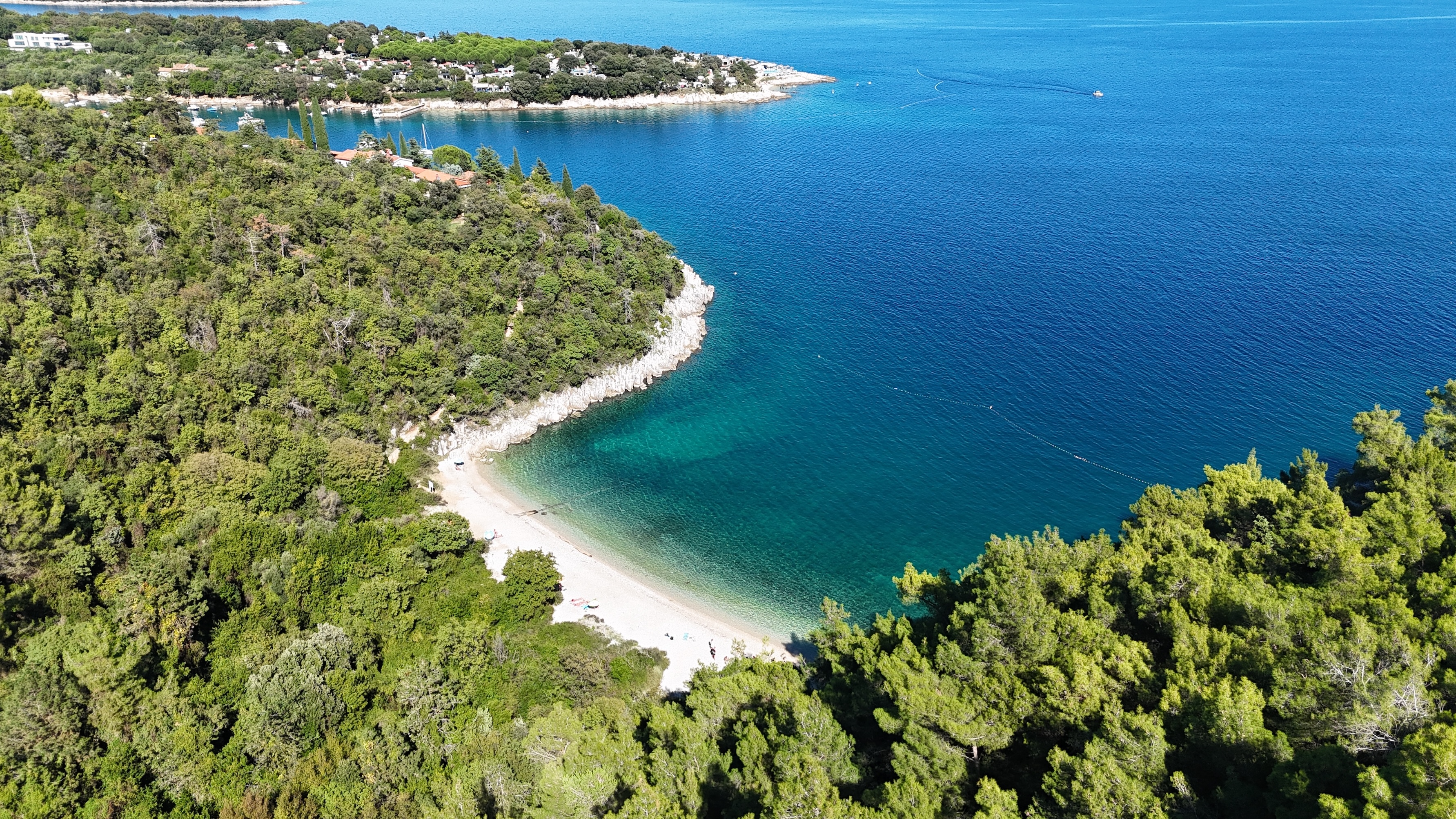 Sveta Marina bay and peninsula Sveta Marina peninsula, village and blue bay from the air