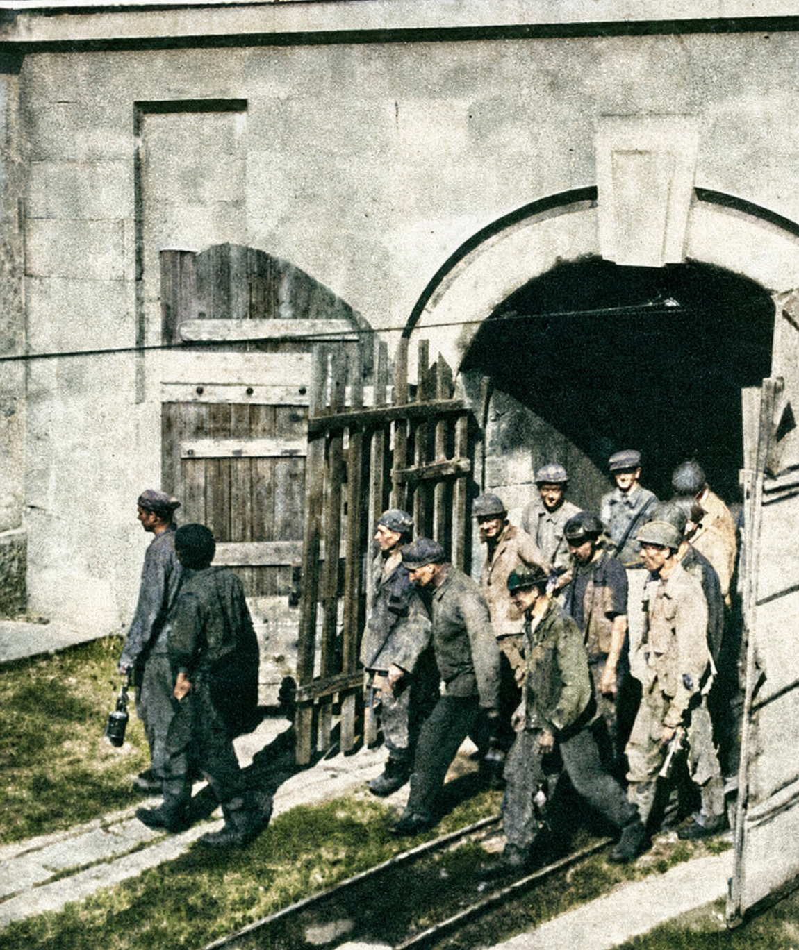 Colorized archival photograph of miners leaving the Raša pit in the 1950s Colorized archival photograph of miners leaving the Raša pit in the 1950s