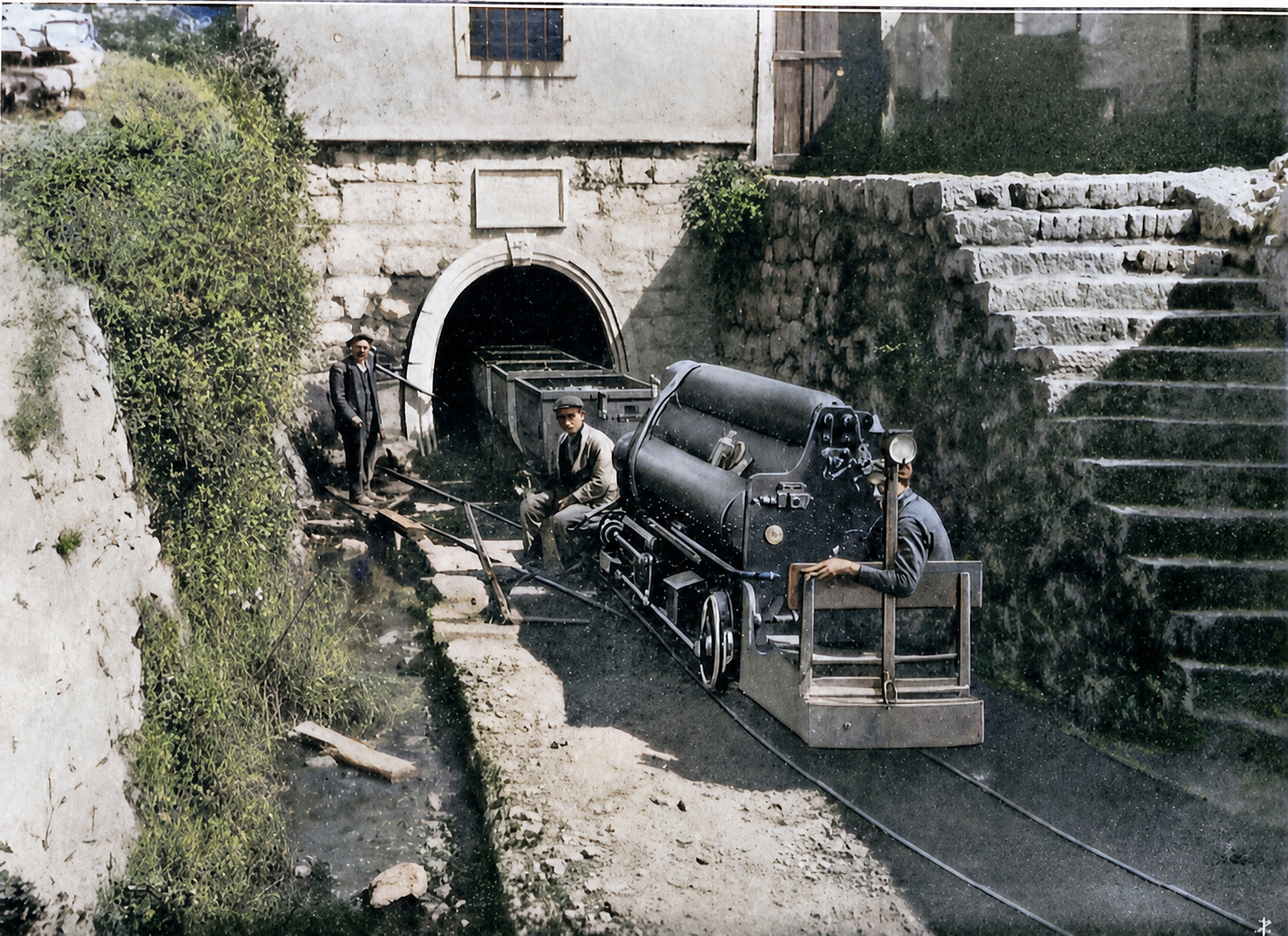 Colorized archival photograph of a mine locomotive at the Leone-Clement portal Colorized archival photograph of a mine locomotive at the Leone-Clement portal