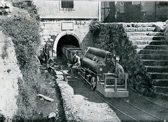 Locomotive at Leone-Clement Compressed-air locomotive emerging from the Leone-Clement mine portal