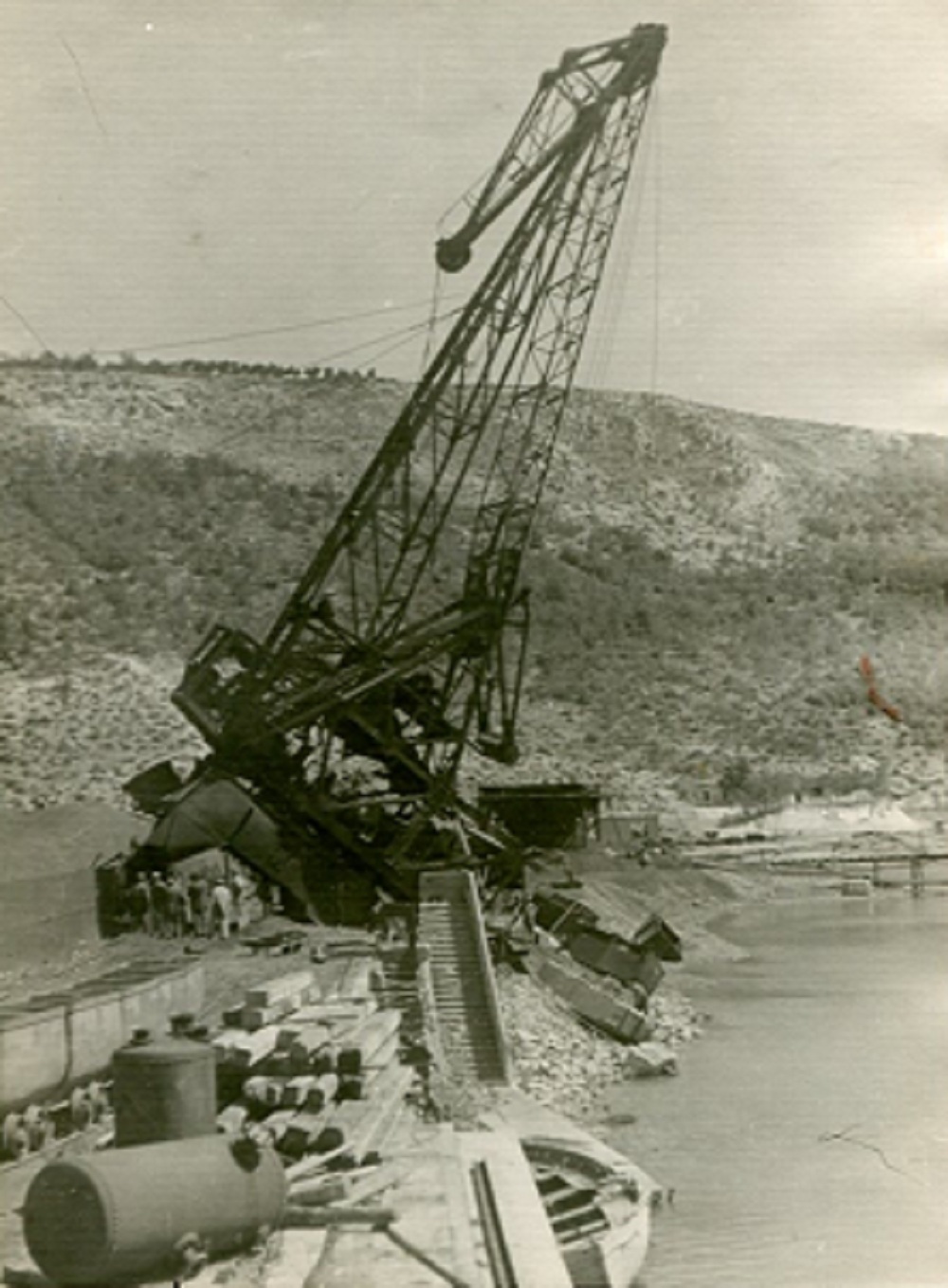Bršica port after bombing Damaged loading crane at Bršica port after wartime bombing
